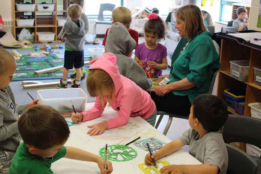 Children doing different activities around their classroom